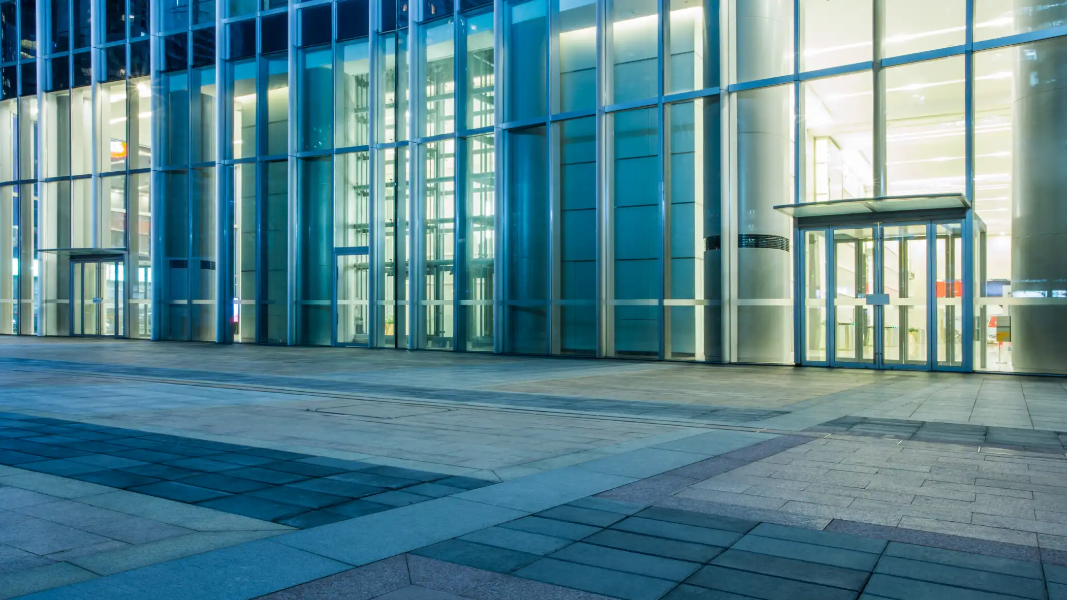 glass office building with automatic doors